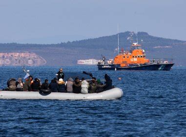 Greek coast guard rescues scores of migrants from boats drifting in the Aegean Sea